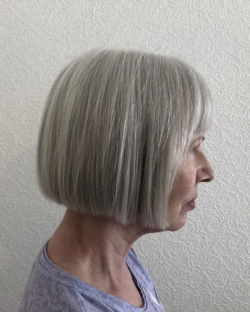 Sleek grey bob with a full fringe